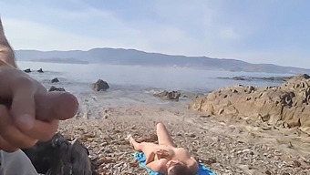 A Nudist Milf Gets Surprised By An Exhibitionist On The Beach